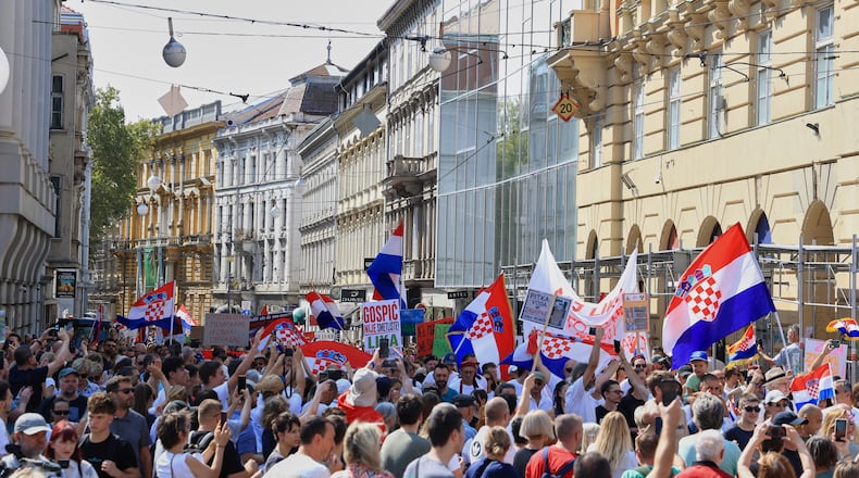 Thousands of people rally in protest over the discovery of illegally imported and disposed waste, including hazardous and toxic materials, in downtown Zagreb, Croatia, Saturday, Sept. 5, 2026. (AP Photo)