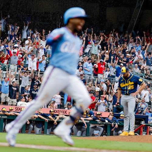 Fans cheers as Braves second baseman Ozzie Albies runs after hitting the winning two-run home run off Brewers pitcher Aaron Ashby (back right) on Saturday, June 20, 2026, in Atlanta. Despite a subpar June, the Braves still lead the NL East. (Erik S. Lesser/AP)