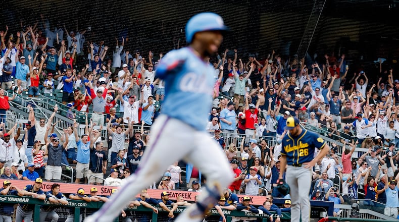 Fans cheers as Braves second baseman Ozzie Albies runs after hitting the winning two-run home run off Brewers pitcher Aaron Ashby (back right) on Saturday, June 20, 2026, in Atlanta. Despite a subpar June, the Braves still lead the NL East. (Erik S. Lesser/AP)