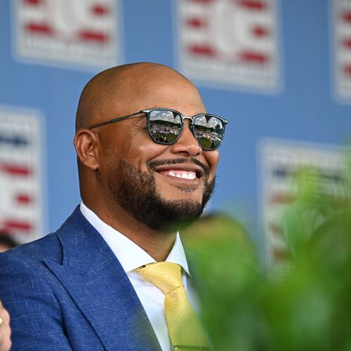 Andruw Jones smiles as he sits with other members of the National Baseball Hall of Fame during the 2026 National Baseball Hall of Fame induction ceremony at the Clark Sports Center on Sunday, July 26, 2026, in Cooperstown, N.Y. (Hyosub Shin/AJC)