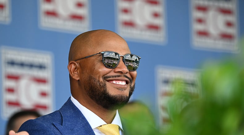 Andruw Jones smiles as he sits with other members of the National Baseball Hall of Fame during the 2026 National Baseball Hall of Fame induction ceremony at the Clark Sports Center on Sunday, July 26, 2026, in Cooperstown, N.Y. (Hyosub Shin/AJC)