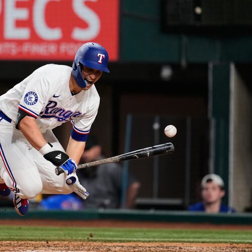 Texas Rangers' Corey Seager reacts to being hit by a pitch in the ninth inning of a baseball game against the Arizona Diamondbacks Monday, May 11, 2026, in Arlington, Texas. (AP Photo/Tony Gutierrez)