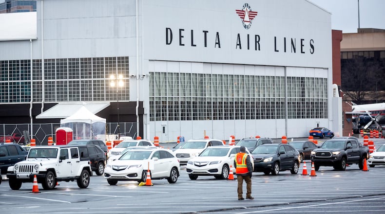 Cars line up at the Delta Air Museum when it was one of the four mass COVID-19 vaccination sites, Monday morning, February 22, 2021. STEVE SCHAEFER FOR THE ATLANTA JOURNAL-CONSTITUTION