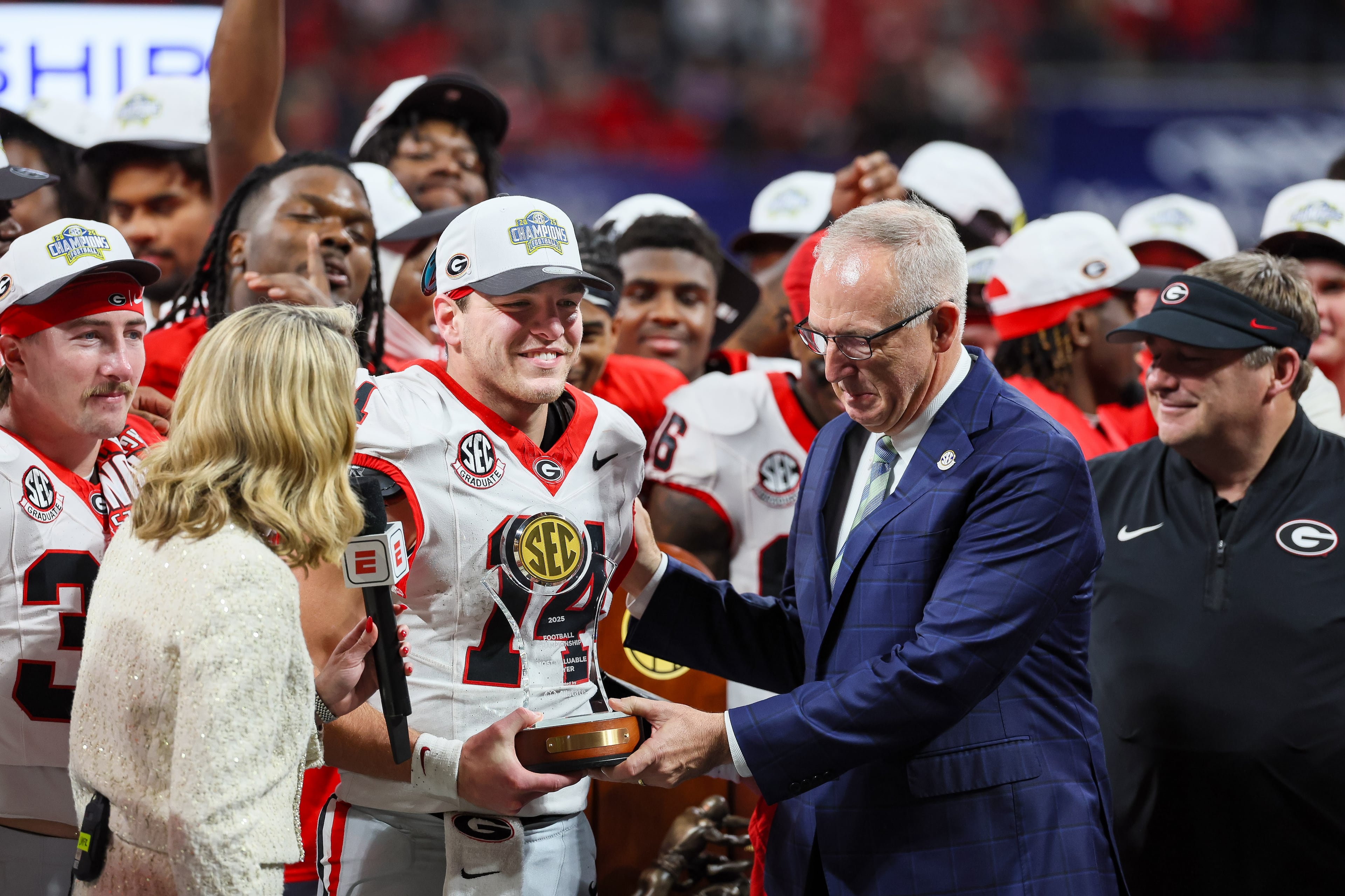 Georgia quarterback Gunner Stockton (14) celebrates a 28-7 victory over Alabama in the SEC Championship game at Mercedes-Benz Stadium, Saturday, Dec. 6, 2025, in Atlanta. (Jason Getz / AJC)