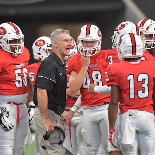 Coach Bill Stewart (center) is best known for his time at North Gwinnett, where his record was 60-19 in six seasons. (Hyosub Shin/AJC 2019)