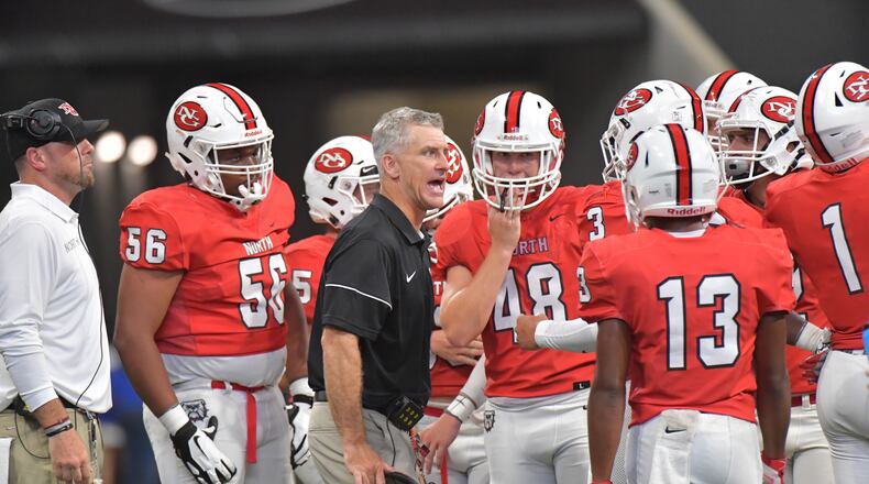Coach Bill Stewart (center) is best known for his time at North Gwinnett, where his record was 60-19 in six seasons. (Hyosub Shin/AJC 2019)