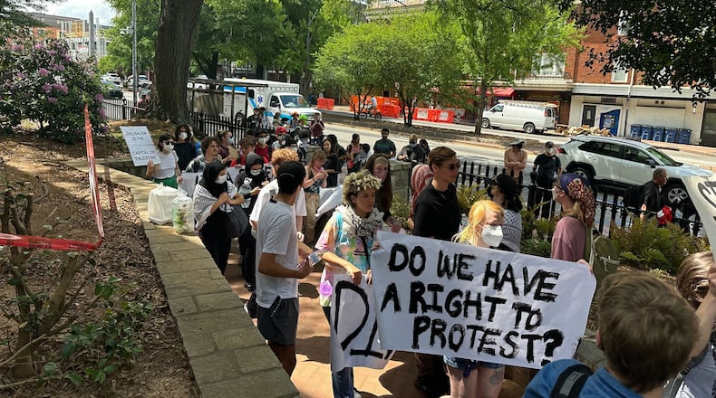 Demonstrators protesting the Israel-Hamas war in Gaza carry a banner asking "Do we have a right to protest?" at the University of Georgia on April 29. The University System of Georgia on July 1 published its annual free speech report, which stated that schools prepared extensively for campus protests. (Fletcher Page/AJC file photo)