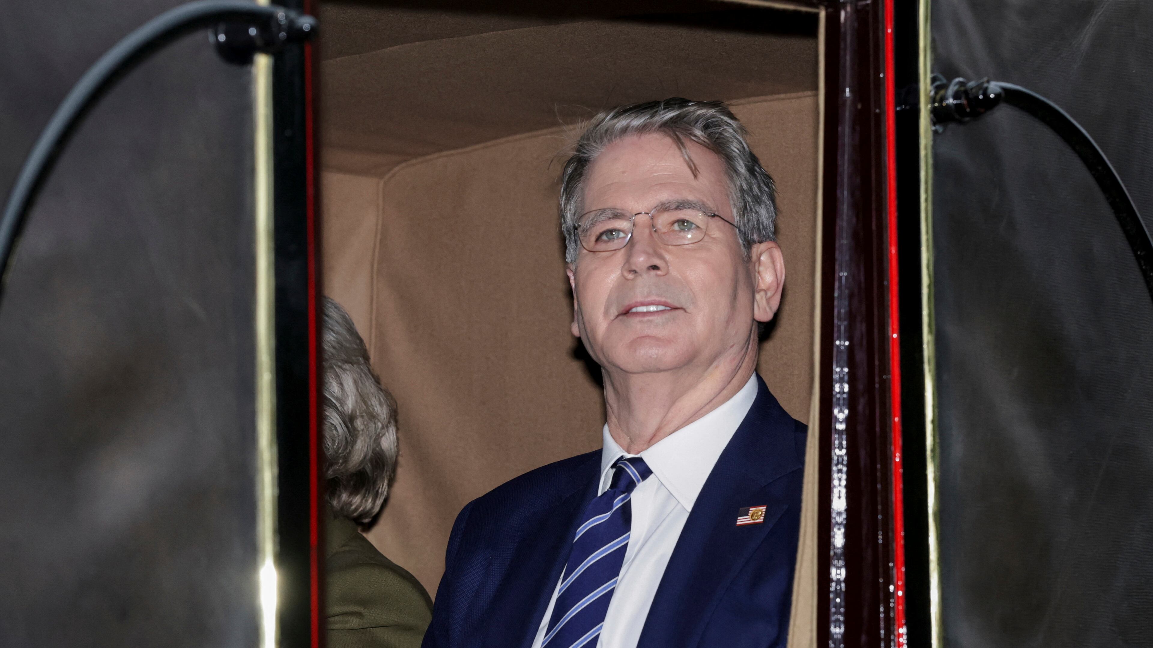 US Treasury Secretary Scott Bessent rides in a carriage during a procession through Windsor Castle on the occasion of President Donald Trump's visit, in Windsor, England, Wednesday, Sept. 17, 2025. (Toby Melville/Pool Photo via AP)