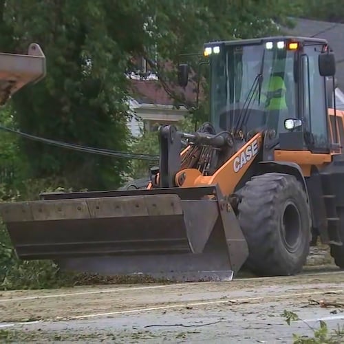 This image made from a video provided by ABC 7 Chicago shows crews working to restore power on Tuesday, Aug. 18, 2026, in Griffith, Ind., more than a week after storms leveled trees and knocked down power lines across the region. (ABC 7 Chicago via AP)