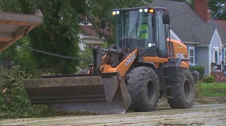This image made from a video provided by ABC 7 Chicago shows crews working to restore power on Tuesday, Aug. 18, 2026, in Griffith, Ind., more than a week after storms leveled trees and knocked down power lines across the region. (ABC 7 Chicago via AP)