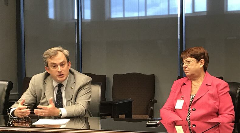 Now-former MARTA Board of Directors Chairman Robbie Ashe (left) and Gwinnett County Commission Chairman Charlotte Nash speak with members of the media in September after the MARTA board approved a contract to provide transit services in Georgia’s second largest county. TYLER ESTEP / TYLER.ESTEP@AJC.COM