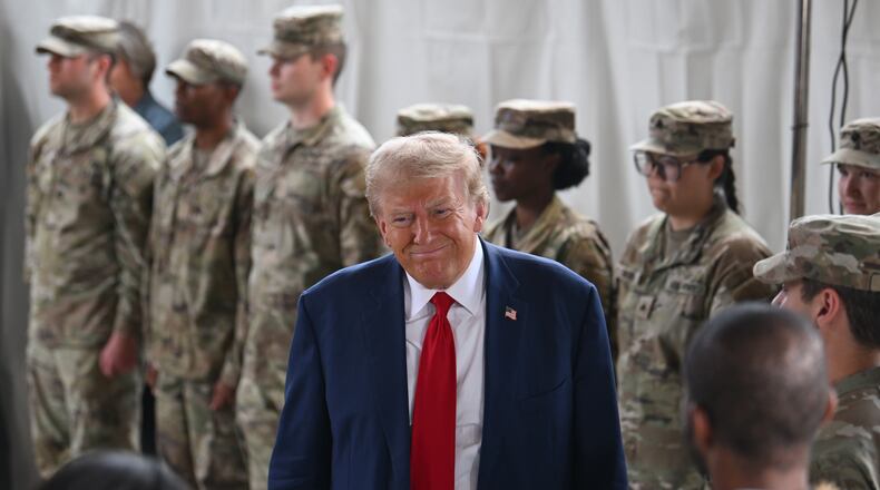 Former President Donald Trump and Gov. Brian Kemp (not pictured) arrive before they deliver remarks to members of the press at Columbia Performing Arts Center, Friday, October 4, 2024, in Evans. Former President Donald Trump and Gov. Brian Kemp made their first appearance together since before the 2020 election, traveling to east Georgia to survey damage from Hurricane Helene. (Hyosub Shin / AJC)
