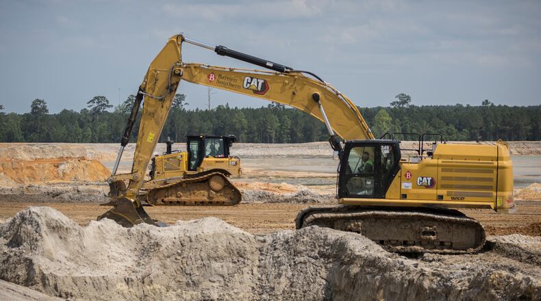 ELLABELL, GA. - JUNE 5, 2023: A bulldozer and an excavator work in a large reservoir at the construction site of the Hyundai Metaplant, Monday, June 5, 2023, in Ellabell, Ga. (AJC Photo/Stephen B. Morton)