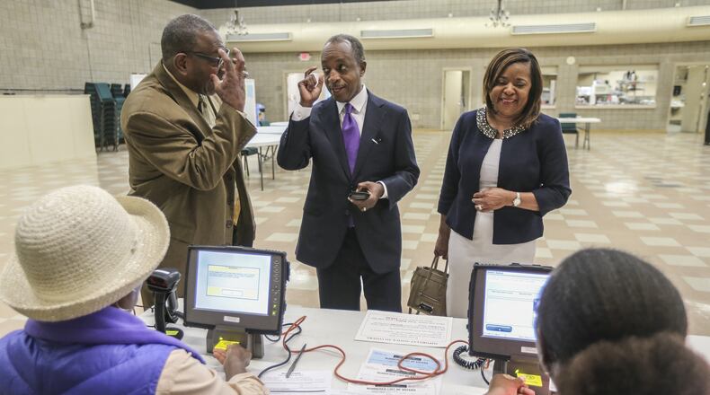 Incoming DeKalb County CEO Mike Thurmond is planning to take office in January. Voters overwhelmingly elected Thurmond last week. He’s pictured here after voting with DeKalb schools Superintendent Steve Green and his wife, Zola Thurmond, in the May 24 primary election. JOHN SPINK / JSPINK@AJC.COM
