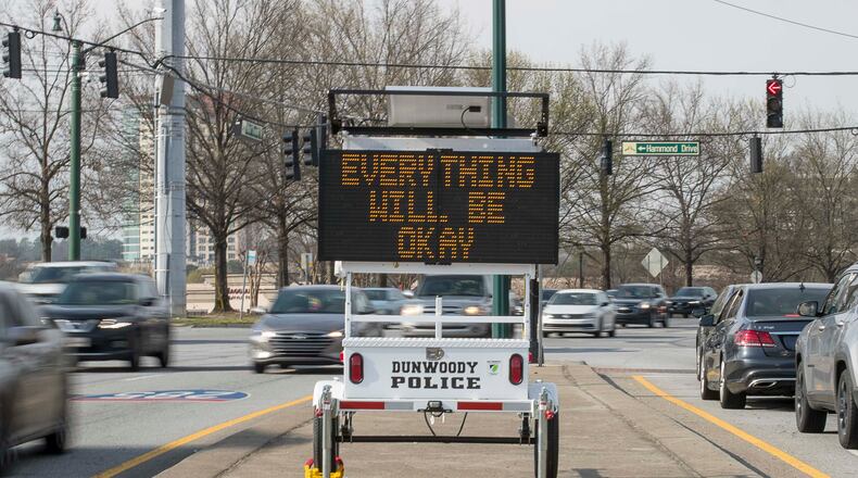 A Dunwoody police electronic sign gives a hopeful message to drivers in March. (ALYSSA POINTER/ALYSSA.POINTER@AJC.COM)