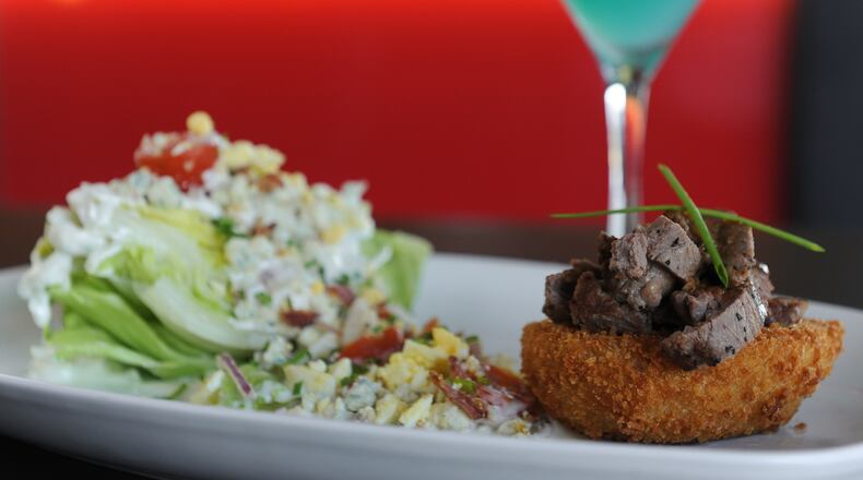 Steak & Wedge- Sliced beef tenderloin on a thick cut onion ring and a loaded iceberg wedge. COEROC Blue- Cîroc vodka & Blue Curacao, a splash of grapefruit juice and orange twist.