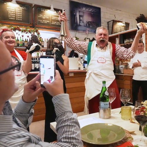 Butcher Dario Ceccini of Italy, welcomes guests to a private dinner at the South Beach Wine and Food Festival Saturday, Feb. 21, 2026, in Miami Beach, Fla. (AP Photo/Marta Lavandier)