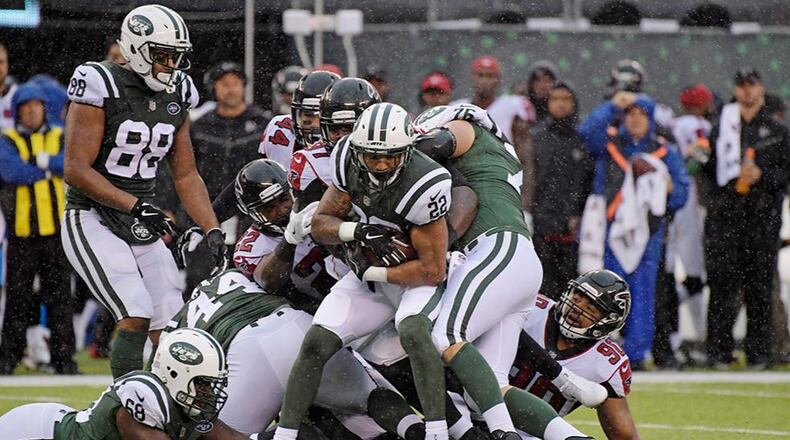 New York Jets' Matt Forte (22) is tackled during the first half of an NFL football game against the Atlanta Falcons Sunday, Oct. 29, 2017, in East Rutherford, N.J. (AP Photo/Bill Kostroun)