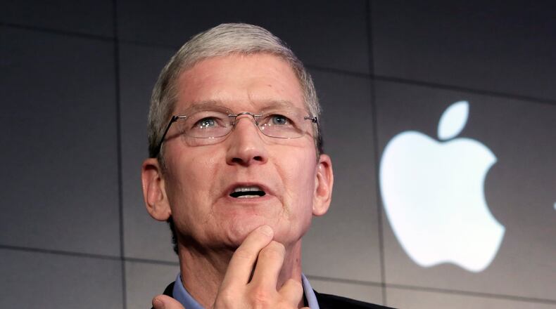 Apple CEO Tim Cook, perhaps wondering how to talk some tax sense into Hillary Clinton and other liberals. (AP file photo)