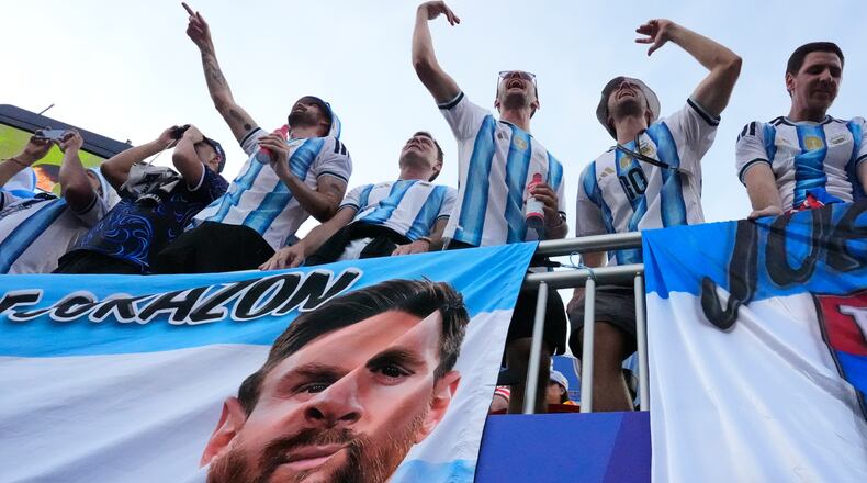 Argentinian fans react ahead of the World Cup Group J soccer match between Argentina and Algeria in Kansas City, Mo., Tuesday, June 16, 2026. (AP Photo/Charlie Riedel)