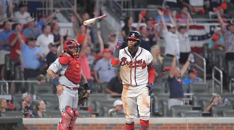 Braves center fielder Ronald Acuna Jr. flips his bat after his ninth-inning home run.