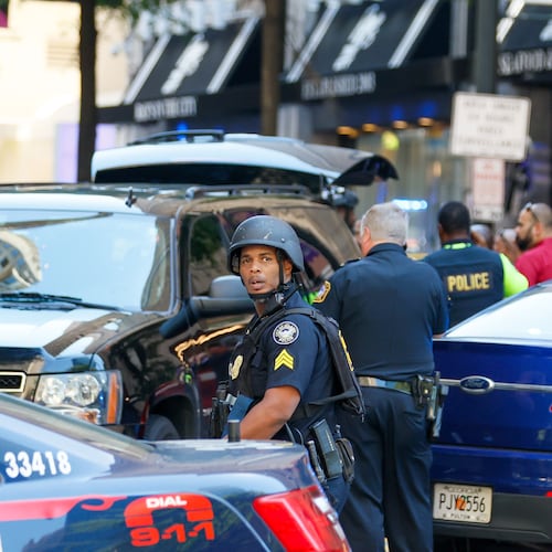 Agents with multiple agencies converge at the scene of a shooting in a busy downtown Atlanta food court at the Peachtree Center on Tuesday, June 11, 2024. One of the witnesses to the shooting later boarded a Ride Gwinnett bus and shot Ernest Byrd Jr., according to a recent lawsuit.
(Miguel Martinez/AJC)