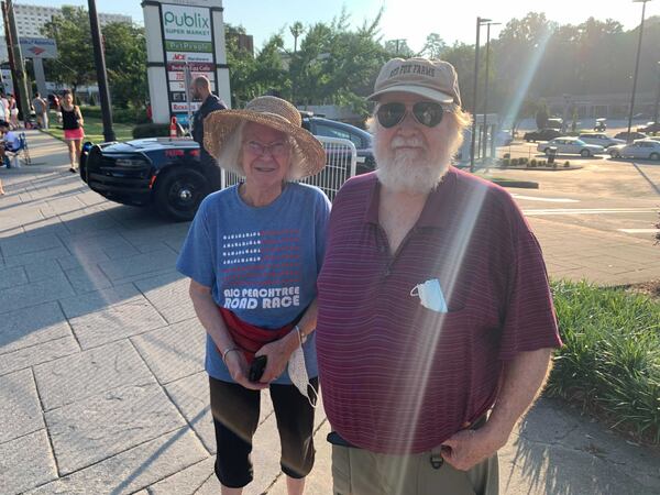 Bruce and Dell MacGregor, 78 and 76 respectively, have been cheering on road racers for years. (Photo: Isaiah Poritz/AJC)