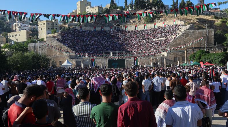 Jordanian soccer fans watch the World Cup match between Jordan and Austria on a large screen at the Roman Amphitheater in downtown Amman, Jordan, early Wednesday, June 17, 2026. (AP Photo/Raad Adayleh)