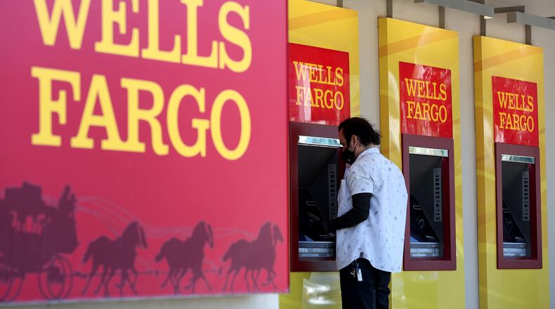 A Wells Fargo customer uses the ATM at a bank branch on Tuesday, Aug. 8, 2023, in San Bruno, Calif. (Justin Sullivan/Getty Images/TNS)