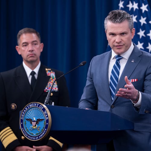 Defense Secretary Pete Hegseth is joined by Adm. Brad Cooper, left, as he speaks to members of the media during a press briefing at the Pentagon, Thursday, April 16, 2026 in Washington. (AP Photo/Kevin Wolf)