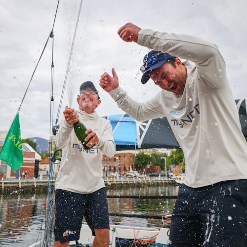 In this photo provided by the Cruising Yacht Club of Australia, sailors Michel Quintin, left, and Yann Rigal celebrate their arrival in Hobart, Australia, Tuesday, Dec. 30, 2025, after competing in the Sydney Hobart yacht race. (Salty Dingo/CYCA via AP)