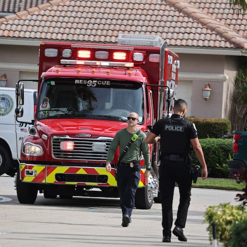 Emergency personnel from Coral Springs and Coconut Creek are on scene where a plane crashed in the Windsor Bay community in Coral Springs on Monday, Nov. 10, 2025. (Carline Jean/South Florida Sun-Sentinel via AP)