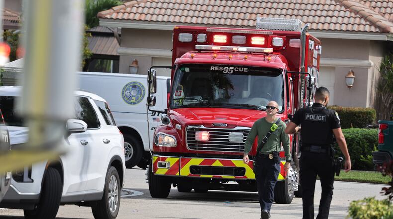Emergency personnel from Coral Springs and Coconut Creek are on scene where a plane crashed in the Windsor Bay community in Coral Springs on Monday, Nov. 10, 2025. (Carline Jean/South Florida Sun-Sentinel via AP)