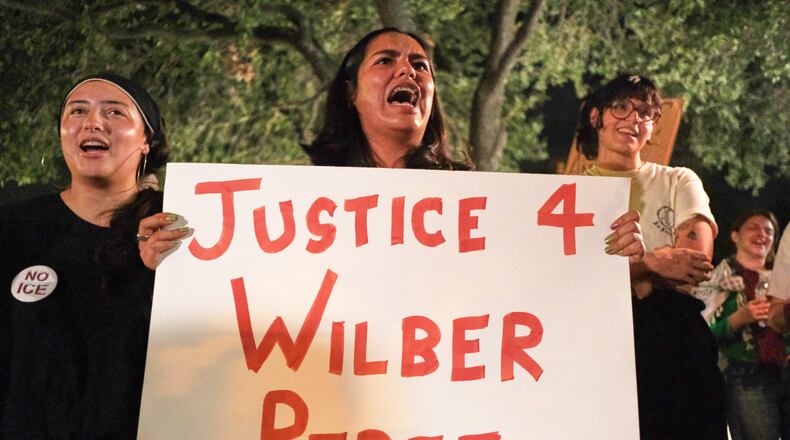 Demonstrators gather in response to the shooting of Wilber Rafael Garces Perez, a Venezuelan man who was shot in his vehicle by an ICE officer the previous day in Austin, Texas, Monday, Sept. 21, 2026. (AP Photo/Joel Angel Juarez)