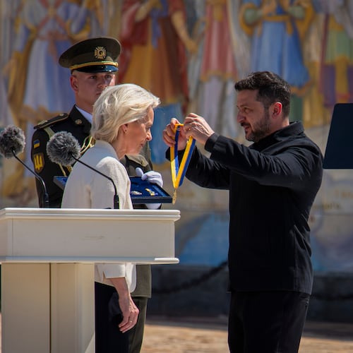 Ukrainian President Volodymyr Zelenskyy, right, awards European Commission President Ursula von der Leyen in Kyiv, Ukraine, Wednesday, July 15, 2026. (AP Photo/Dan Bashakov)