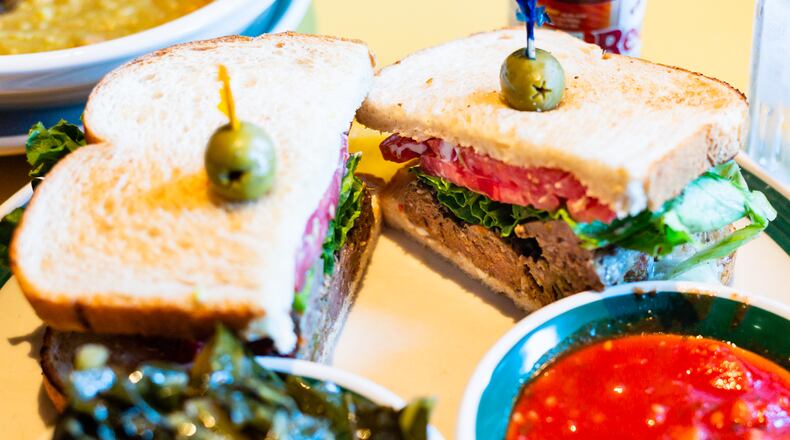The meatloaf sandwich at OK Cafe is served with  tomato sauce on the side.