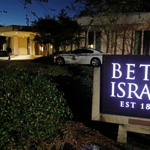 FILE - This Nov. 2, 2018 photo shows an armed Hinds County Sheriff's deputy outside of the Beth Israel Congregation synagogue in Jackson, Miss. (AP Photo/Rogelio V. Solis, file)