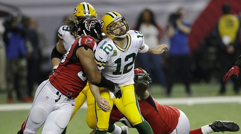 Atlanta Falcons defensive end Dwight Freeney (93) hits Green Bay Packers’ Aaron Rodgers after he throws during the second half of the NFC championship game Sunday, Jan. 22, 2017, in Atlanta. (David J. Phillip/AP)