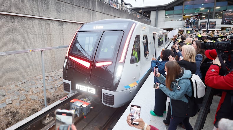 Members of the press and guests record the arrival of the new MARTA train at Lindbergh station during the unveiling of the new MARTA trains on Thursday, January 30, 2025.
(Miguel Martinez/ AJC)