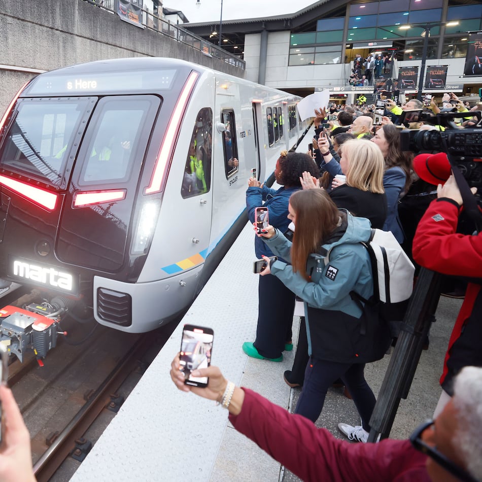 Members of the press and guests record the arrival of the new MARTA train at Lindbergh station on Thursday, Jan. 30, 2025, in Atlanta. The transit agency is in the process of replacing its aging fleet of train cars. (Miguel Martinez/AJC 2025)