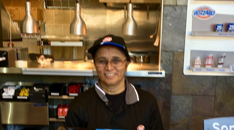 She’s back! The familiar face of Nadera Momin is once again behind the counter at Decatur’s Dairy Queen which opens its new store 10:30 a.m. Sunday. Nisar Momin bought the original barn-shaped Decatur DQ in 1986 and ran it until it was closed and subsequently demolished in 2014. Nisar is back this time around along with his brother-in-law Rasul Momin and Nadera (Rasul’s wife). Bill Banks for the AJC