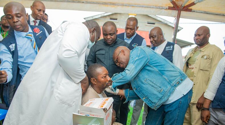 Congo’s Health Minister Roger Kamba administers an Ebola vaccine to a health care worker in Kisangani, Congo, Thursday, Aug. 27, 2026. (AP Photo/Samy Kamanga)