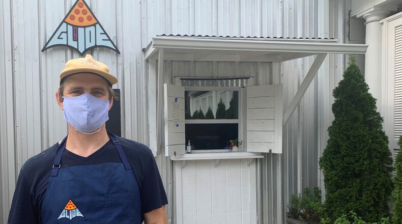 Rob Birdsong in front of his Glide Pizza window on the Eastside Beltline