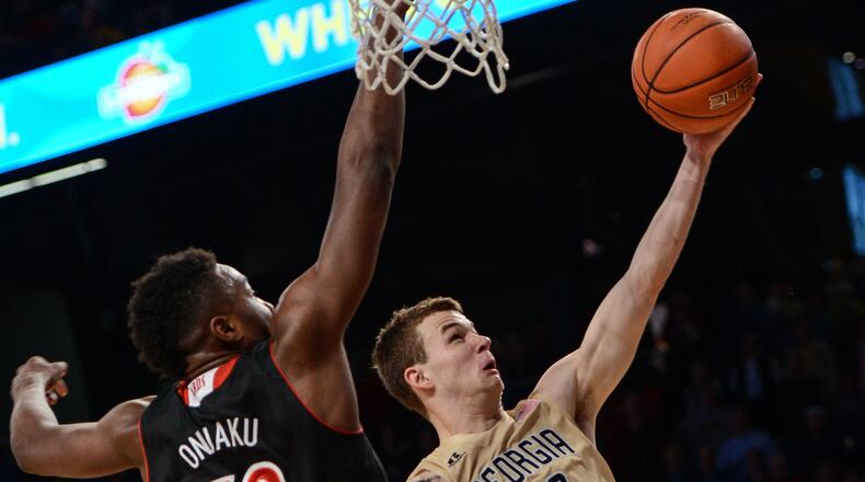 Georgia Tech guard Travis Jorgenson (10) shoots against Louisville forward/center Chinanu Onuaku (32) during the second half of an NCAA college basketball game, Monday, Feb. 23, 2015, in Atlanta. Louisville won 52-51. (AP Photo/Jon Barash) Georgia Tech and guard Travis Jorgenson nearly pulled off the upset of No. 17 Louisville, but again fell short, falling 52-51. (ASSOCIATED PRESS)