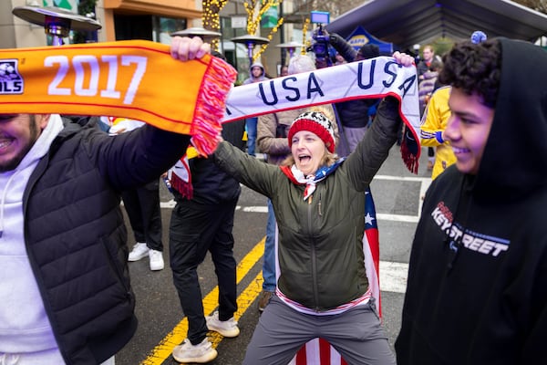 City officials have estimated that World Cup fans — like these celebrating during the World Cup draw party in Atlanta in December — will generate about $500 million in economic impact during tournament matches this summer. (Arvin Temkar/AJC)