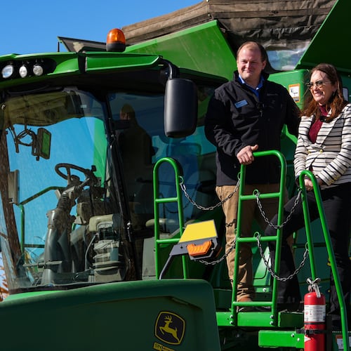 U.S. Secretary of Agriculture Brooke L. Rollins, right, films a social media post on a combine with farm owner Tyler Everett during a farm tour in Lebanon, Ind., Thursday, Oct. 30, 2025. (AP Photo/Michael Conroy)