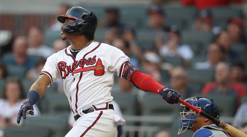 Ronald Acuna hits leadoff single against the New York Mets on Tuesday, Aug. 13, 2019, in Atlanta.