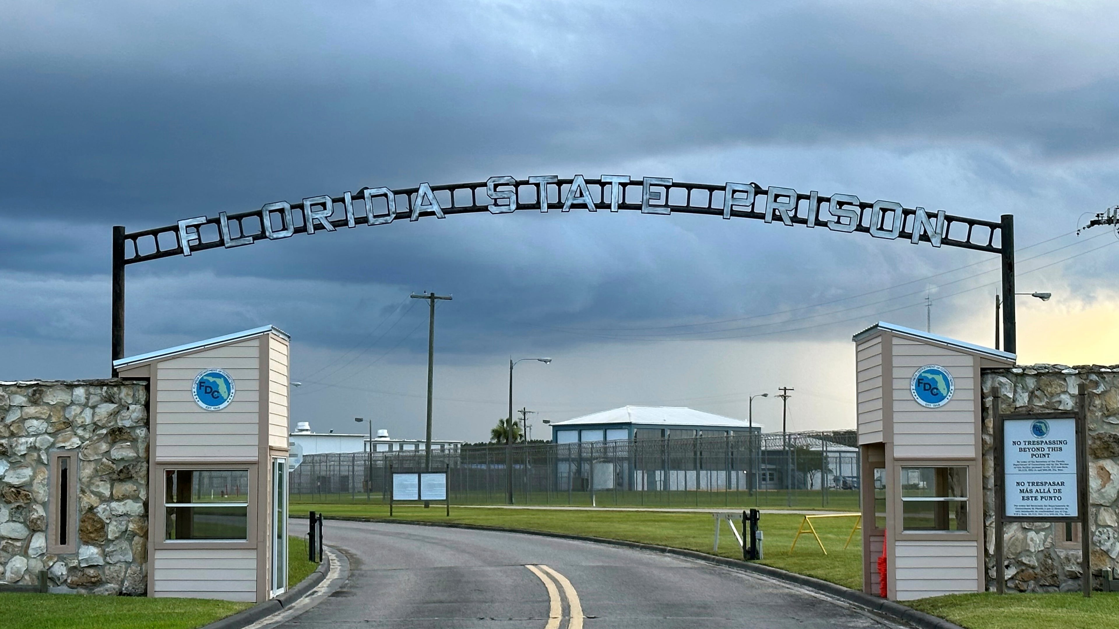 FILE - Clouds hover over the entrance of the Florida State Prison in Starke, Fla., Aug. 3, 2023. (AP Photo/Curt Anderson, file)