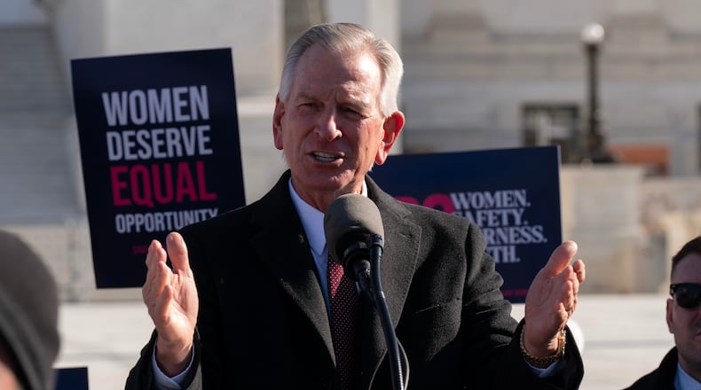 FILE - Sen. Tommy Tuberville, R-Ala., speaks to the crowd as protesters gather outside the Supreme Court as it hears arguments over state laws barring transgender girls and women from playing on school athletic teams, Jan. 13, 2026, in Washington. (AP Photo/Jose Luis Magana, File)