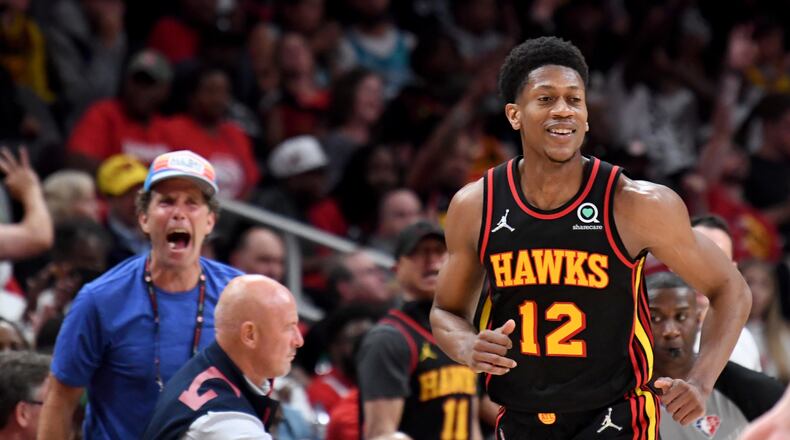 Hawks forward De'Andre Hunter (12) reacts after scoring during the second half. (Hyosub Shin / Hyosub.Shin@ajc.com)